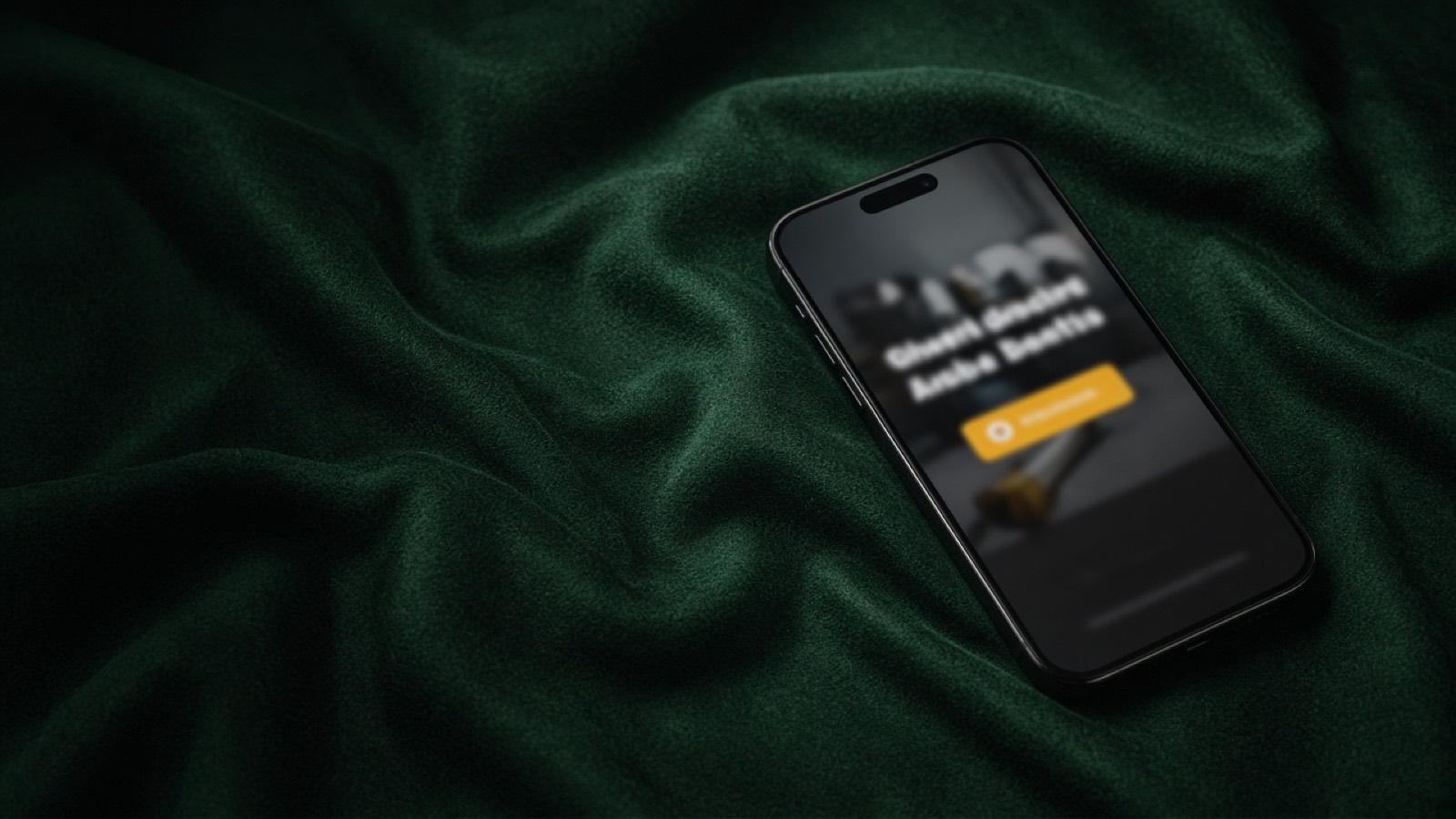 Smartphone on dark green fabric showing a trade business website